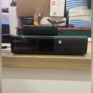 Xbox 360 used but taken care of has 1 controller and has 10 games